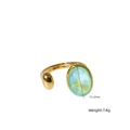 Bague ouverte en acier titane doré avec un grand cristal ovale facetté vert clair - Opale bleue