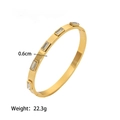 Detail showing gold titanium steel bracelet with 0.6cm width and five rectangular zircons - White Zirconia (YB640) / White