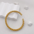 Detailed close-up of a gold woven mesh open bangle with smooth cylindrical end caps - Woven Cable Style (B713 Gold)