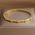 Polished gold-plated titanium steel cuff bracelet with five stylish X-shaped cross charms - Crisscross X Element Style (B753 Gold)