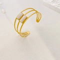 Three-layer gold titanium steel open cuff bracelet with vertical cat eye stones - Triple Layer Cat Eye Stone Style (B766) / Gold