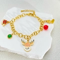 Detail view of a gold Christmas bracelet featuring festive reindeer and santa hat charms - Elk Bracelet