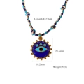 Woven titanium necklace with blue evil eye pendant and gold-tone finish details - Blue Evil Eye Pendant (XB2506027)