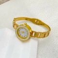 Macro shot of gold quartz watch featuring a crystal bezel and Arabic numeral dial - Square Style