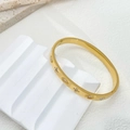 Elegant gold clover bangle bracelet with marquise cubic zirconia and sparkling star accents - Oval Bangle (B873) / White Zirconia Gold