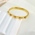 Elegant 18K gold-plated stainless steel sunflower bangle with pink stones on white stone - Pink Bead Style (B939)