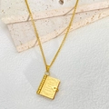 Detail of 18k gold plated book pendant with engraved inspirational quote and heart clasp - Patterned Book Style (N1094)