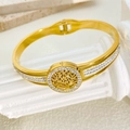 Detail of gold tree of life bangle with white rhinestones and spring clasp mechanism - White Stone Tree Of Life Style (B989)