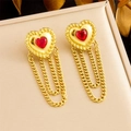 Detail of gold heart tassel earrings with red gemstones in a jewelry gift box display - Red Heart Style / Gold