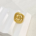Detailed view of adjustable gold-plated square spiral ring with textured hammered finish - Spiral Geometric Style