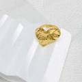 Detailed view of adjustable gold heart ring with unique hammered texture on white stand - Heart Style