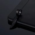 Detail view of a black stainless steel hoop earring featuring a feather wing pendant - Black Feather