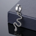 Polished silver stainless steel hoop earrings with snake pendant on dark jewelry box - Snake Pendant Style / Steel