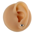 Macro detail of bat stud earring with black stone on a silicone ear model display - Silver Bat Style (B1483)