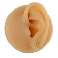 Detail view of a gold safety pin earring featuring micro-pave cubic zirconia on an ear model - Safety Pin Style (B1385) / Gold