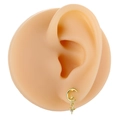 Detailed view of gold moon and star stud earrings with zirconia on a model ear - Gold Star Moon Style (B1418)