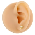 Detail of gold plane stud earring with zircon wings worn on a silicone ear model - Gold Airplane Style (B1393)