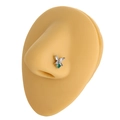 Detailed view of butterfly nose stud with green and white zircons on a model - Butterfly Style (B1258) / Silver