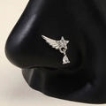 Star and feather wing nose ring with hanging teardrop zircon on black model - Silver