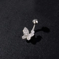Detailopname van een vlinder navelpiercing met zirkonia steentjes op zwarte achtergrond - Pavé Ronde Zirconia Vlinder Stijl (Zilver 1)