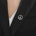 Silver peace sign brooch pin on black suit jacket for a stylish minimalist look - Steel Peace Sign