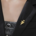 Gold Ankh hexagram yoga symbol brooch pinned on a black suit lapel for men and women - Gold Ankh