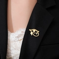 Golden Eye of Horus vintage brooch pinned on black suit lapel for elegant styling - Gold Eye of Horus