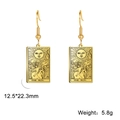 Detailed view of Sun Tarot card earrings featuring engraved XIX Sun and sunflowers - Gold 11