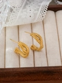 Detailed shot of golden twisted rope C-shaped earrings in a premium wooden jewelry box - Twisted Rope Style (ZHE766 Gold) / Gold