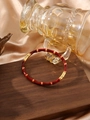 Bamboo style stainless steel bracelet with dark red enamel and gold-tone finish - Dark Red