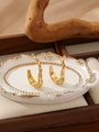 Close-up of golden irregular lava texture hoop earrings on a vintage relief tray - Irregular Lava Texture Style (ZHE2117) / Gold