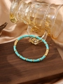 Bamboo style turquoise and gold stainless steel bangle with polished finish - Sky Blue