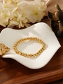 Minimalist elastic bracelet featuring polished gold beads in a high-gloss metallic finish - 5mm Round Bead Style (ZHB1210) / Gold