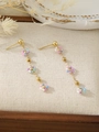 Detail view of long tassel flower earrings with colorful beads and golden chains - Multicolor (ZHE1817)