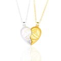 Detail of silver and gold magnetic heart pendants with pinky swear engraving for lovers - Silver + Gold