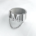Silver grid-textured ring with bold M design and dangling chain detail for women - US 7 / Silver