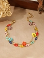 Detail view of double-layered 18K gold-plated bracelet with colorful enamel lip charms - Multicolor Enamel Lip Flower Style (ZHB874 Gold)