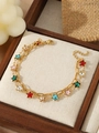 Detail view of double-layer gold chain bracelet with colorful star charms in a wooden box - Multicolor Star Pendant Double-layer Style (ZHB880金)