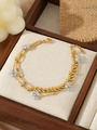 Close-up of gold layered bracelet featuring small light blue flowers on wood and fabric - Light Blue Matte Flower Multi-layer Style (ZHB881金)