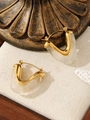 Detail of 18K gold triangle earrings with cream acrylic resin on vintage lace texture - Gold & Cloudy White