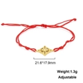 Detail showing red woven cord bracelet with gold flower pendant and size dimensions - Celtic Knot Style-Gold Color