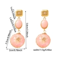 Detailed view of pink resin drop earrings with 5.8cm length and gold-tone alloy studs - Pink Dried Flower Style (ZHE226-Pink)