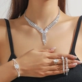 Silver bridal jewelry set featuring tassel fringe necklace, earrings, and bracelet - Silver Tassel Marquise Diamond Multi-Row Necklace Bracelet Ring Earrings Set (PJ--T0294)