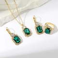 Golden bridal jewelry set with emerald green stones and cubic zirconia accents - Golden Green Rectangle Set (PJ--T0002)