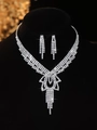 Detailed macro view of bridal rhinestone necklace with sparkling crystal tassels - Silver Flower Tassel Necklace Earrings Set (PJ--T0210)