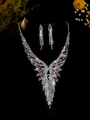 Detailed macro view of bridal jewelry set with pink stones and sparkling crystal tassels - Silver Pink Wing Tassel 2-Piece Set (PJ--T0016--6)