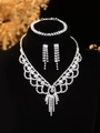 Detailed view of silver bridal jewelry set with sparkling rhinestones on black display - Silver Mesh Tassel Necklace Bracelet Earrings Set (PJ--T0219)