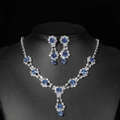 Macro detail of bridal jewelry set with navy blue round stones and silver halo crystals - Silver Blue Flower Cluster Waterdrop Set (PJ--T0020--2)