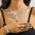 Silver bridal jewelry set with sparkling rhinestones on model for formal events - Silver Geometric Step Necklace Bracelet Earrings Ring Set (PJ--T0233)
