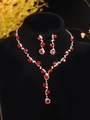 Close-up of luxury bridal jewelry set featuring red faceted gems and silver finish - Silver Red Star Tassel Set (PJ--T0033-2)